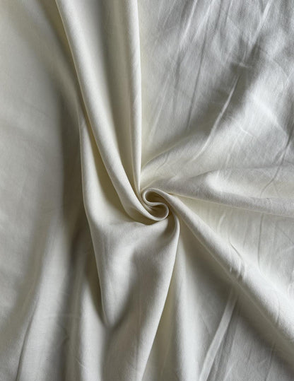 100% lightweight linen in white/cream sold by the 1/2 yard | Sustainable fabric for apparel, great for dresses, tops, pants, etc.